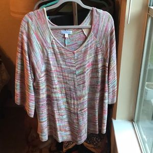 Multi colored light sweater top. Longer in Center
